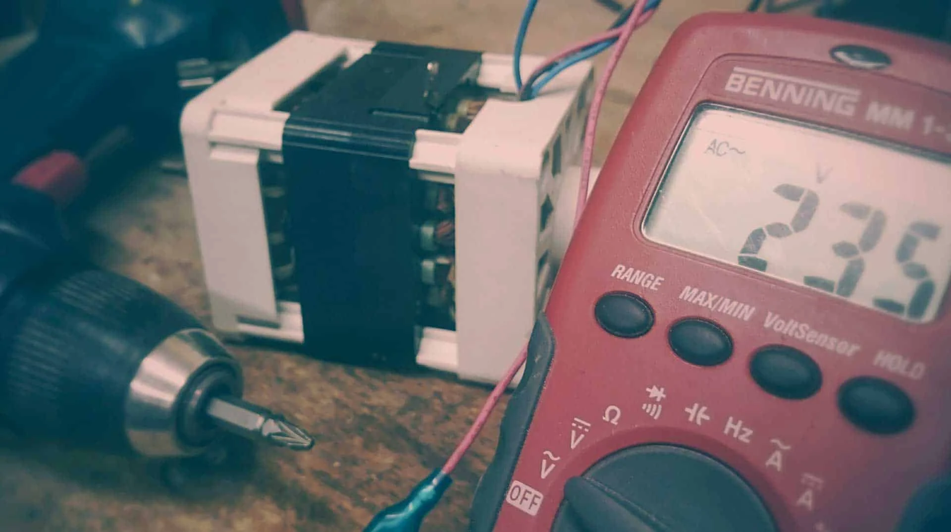 Multimeter testing an electrical component